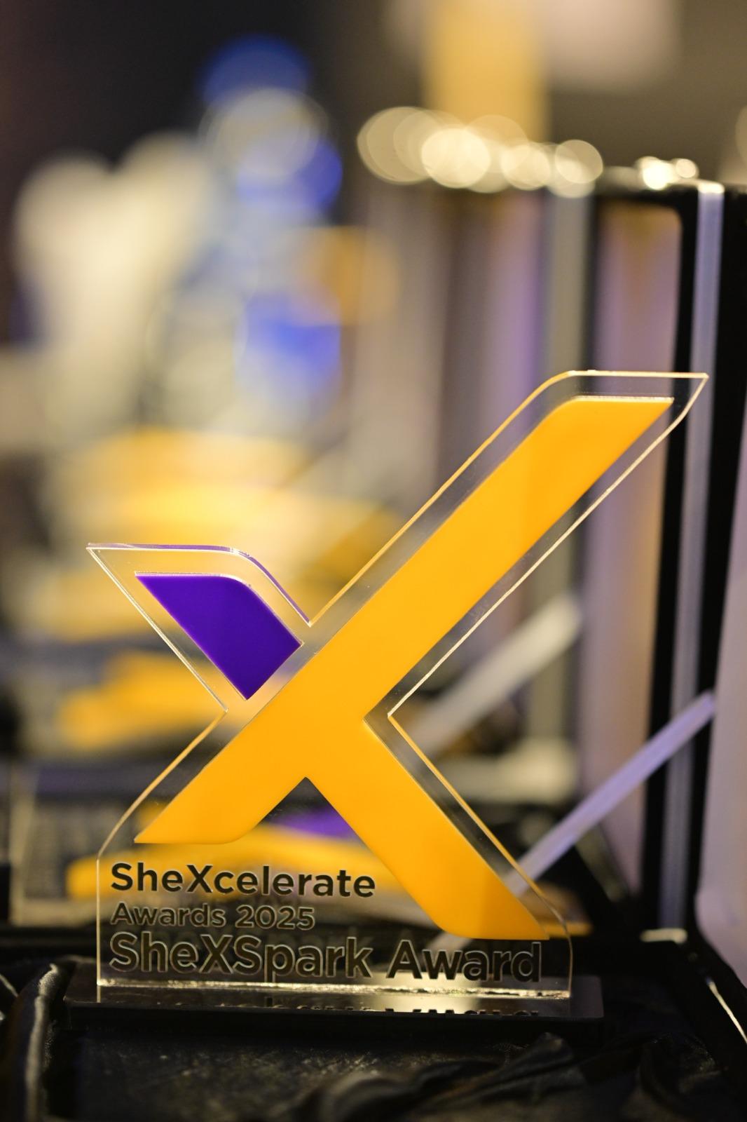 Smiling woman in polka dot dress in business meeting