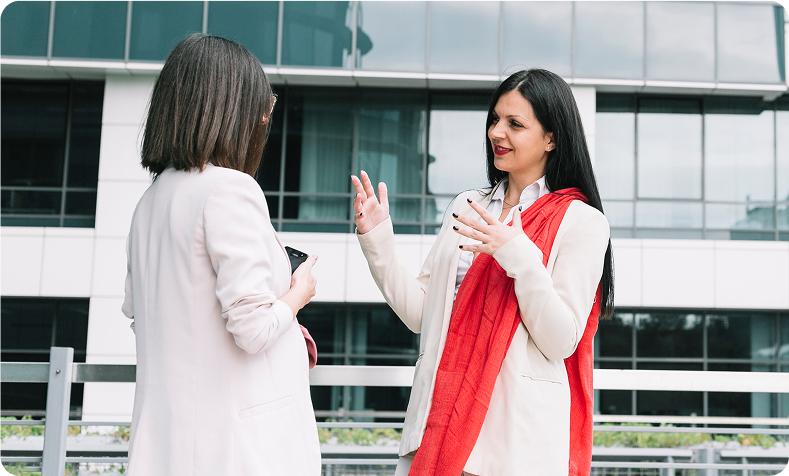 Two professional women in a business meeting